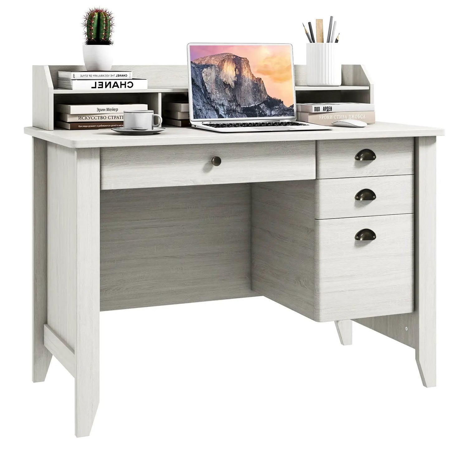Computer desk with 3-drawer pedestal in whitewashed wood finish, laptop setup and books on Tampa Home & Garden Store