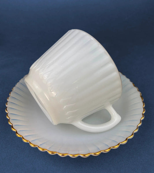 Opalescent Petalware teacup with matching scalloped saucer, white ribbed with gold trim on Tampa Home & Garden Store