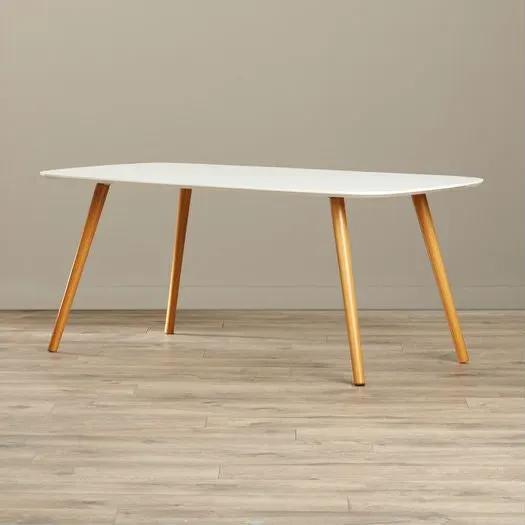 White oval top mid-century coffee table with light wood tapered legs on Tampa Home & Garden Store