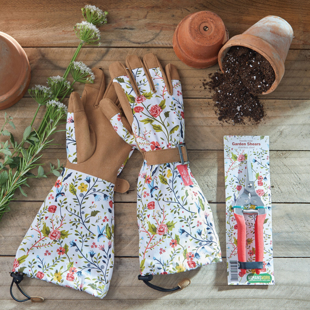 Compact pruning shears by Womanswork with pink handles, floral gloves and terracotta pots on Tampa Home & Garden Store