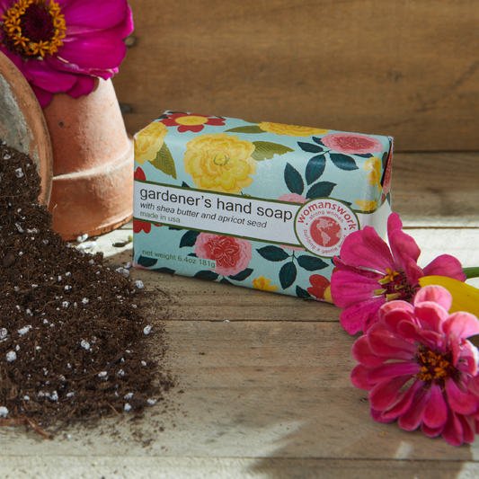 Weeder Glove Spa Gift Set by Womanswork in a colorful floral box beside a potted plant and soil on Tampa Home & Garden Store