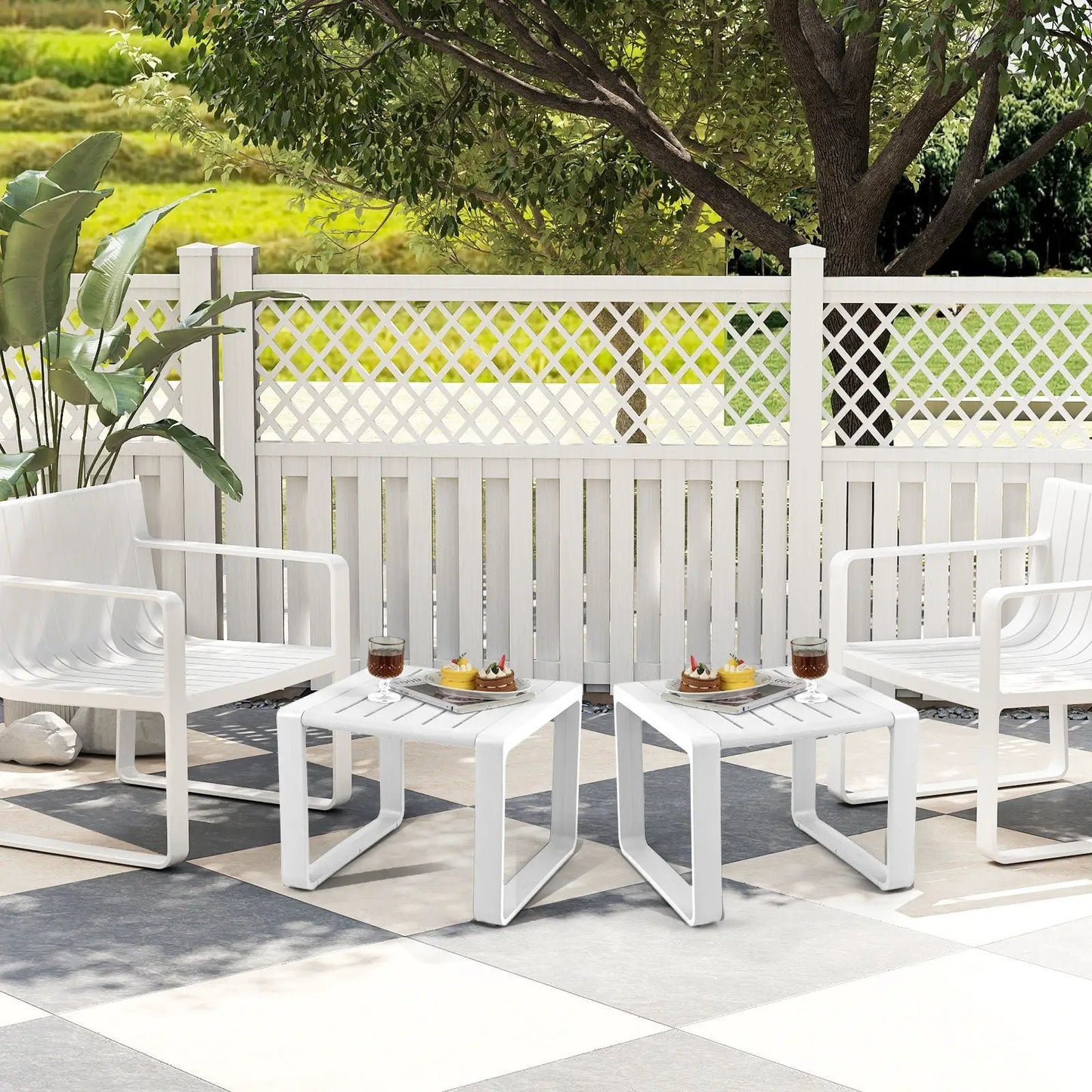 Set of four white modern accent coffee tables with open storage shelf on outdoor patio on Tampa Home & Garden Store