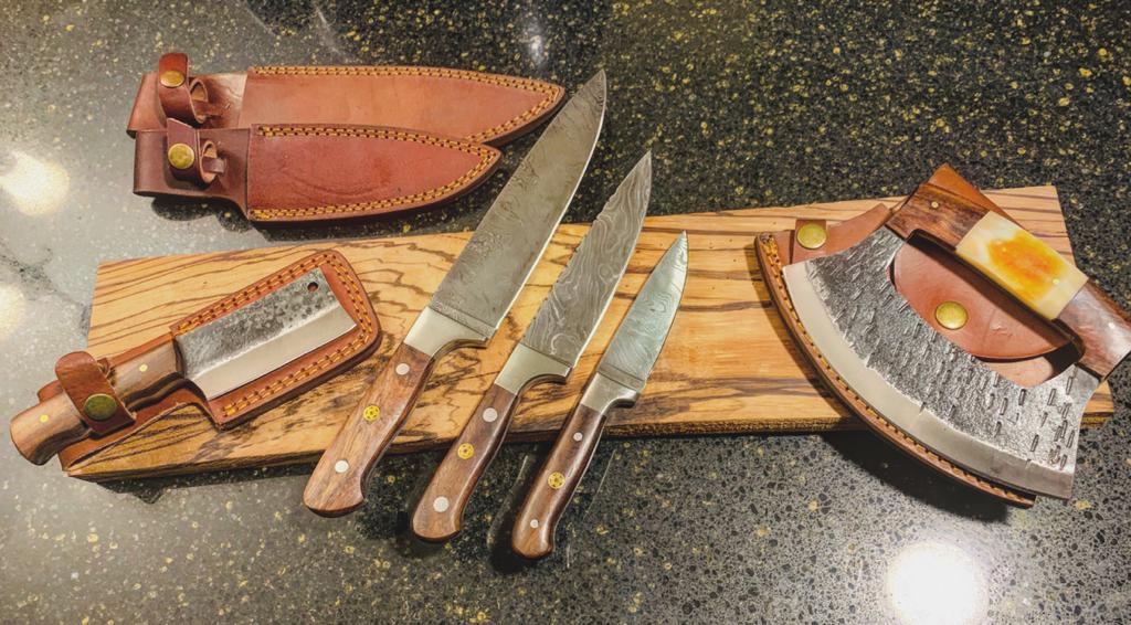 Custom Titan chef knife set with walnut handles five knives on a wood board with leather sheaths on Tampa Home & Garden Store