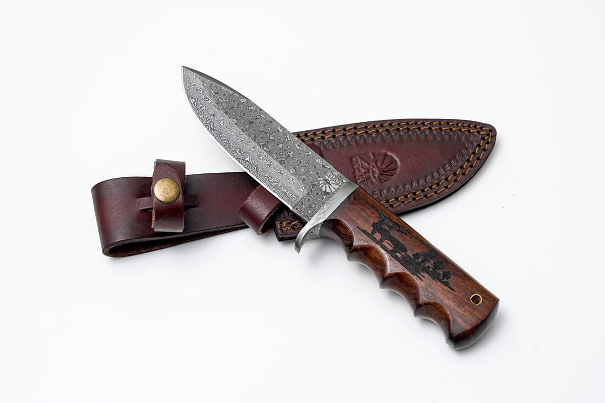 Damascus steel hunting knife with engraved walnut scales and leather sheath on Tampa Home & Garden Store
