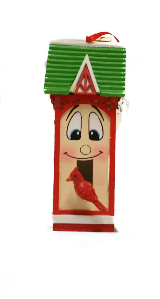 Whimsical wooden birdhouse ornament red and white with green roof and smiling face on Tampa Home & Garden Store