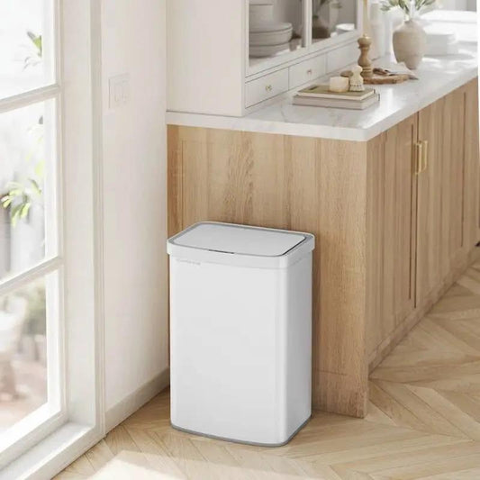 White plastic 13-Gallon kitchen trash can with motion sensor lid beside wood cabinets on Tampa Home & Garden Store