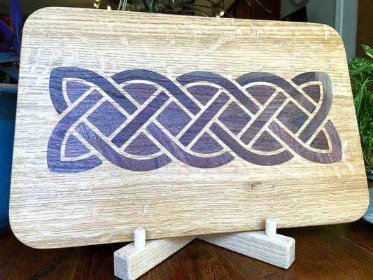 White Oak charcuterie board with dark purple Celtic knot inlay and rounded edges on Tampa Home & Garden Store