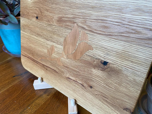 White oak charcuterie board with cherry rose inlay by Fitzgerald Custom Woodcraft on Tampa Home & Garden Store