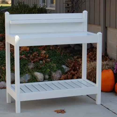 White PVC potting bench with upper work surface and lower slatted shelf, outdoor gardening unit on Tampa Home & Garden Store
