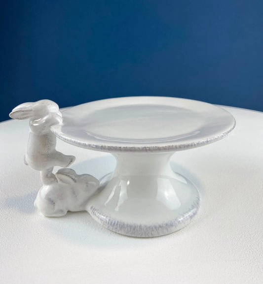 White porcelain cupcake stand in pottery & ironstone with a climbing bunny motif on edge on Tampa Home & Garden Store