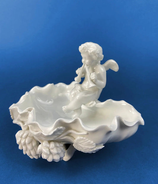 White porcelain Cupid soap dish from Amore Collection with cherub atop a ruffled bowl on Tampa Home & Garden Store