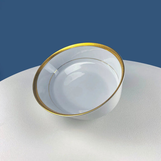 White porcelain oval serving bowl with gold band on Tampa Home & Garden Store