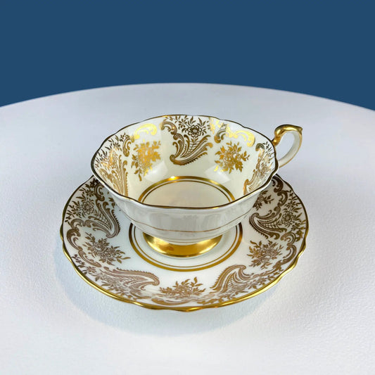 Teacup and saucer set in white porcelain with gold floral trim Paragon Porcelain on Tampa Home & Garden Store