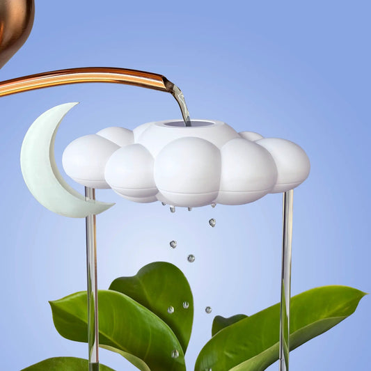 White Dripping Rain Cloud watering spike with glow-in-the-dark moon charm by The Cloud Makers on Tampa Home & Garden Store