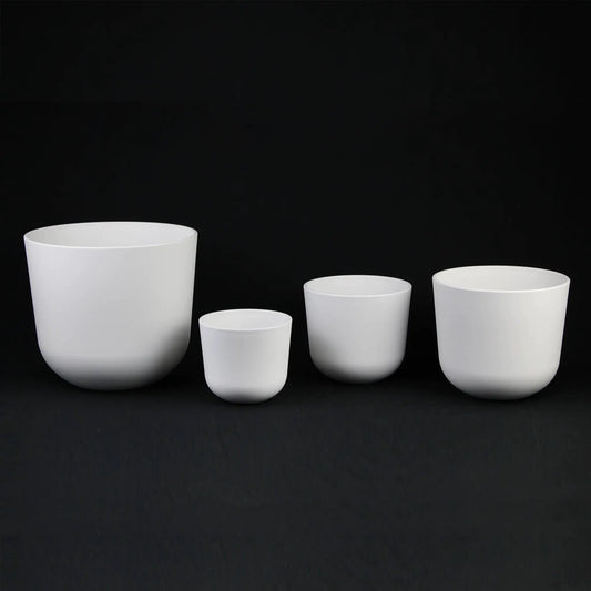 White plastic round planter pot set in varied sizes for indoor use on Tampa Home & Garden Store