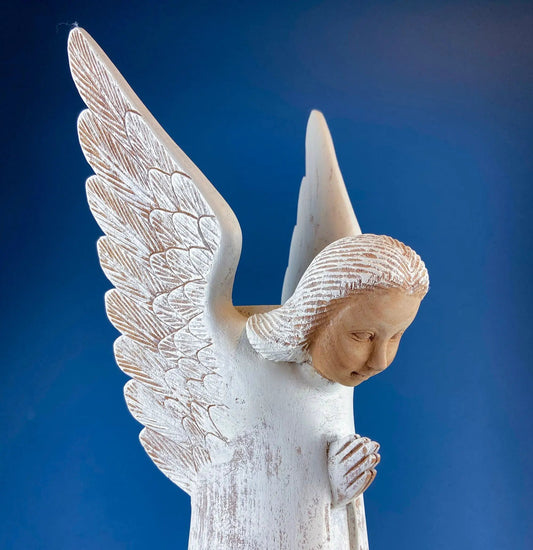 Wooden hand-carved angel figurine with distressed white finish and feathered wings on Tampa Home & Garden Store