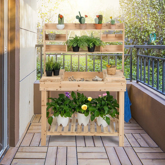 Natural wood potting bench with display shelves and potted plants on a balcony on Tampa Home & Garden Store