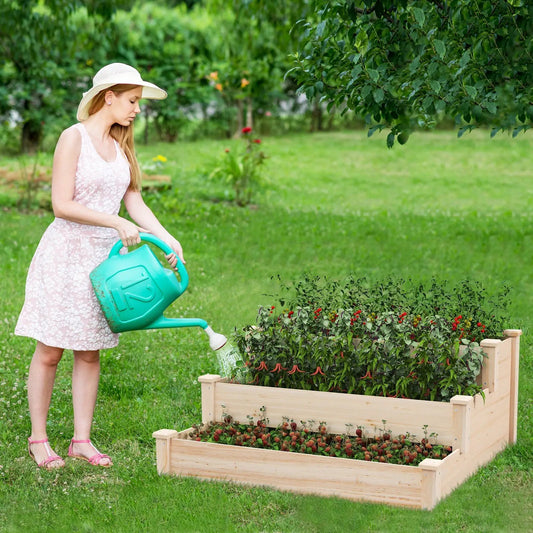 3-Tier wooden raised garden bed for patio with strawberry plants, woman watering with teal watering can on Tampa Home & Garden Store