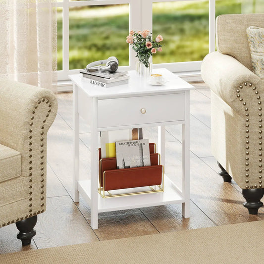 White wood nightstand with drawer and shelf, topped with vase and books near chairs on Tampa Home & Garden Store
