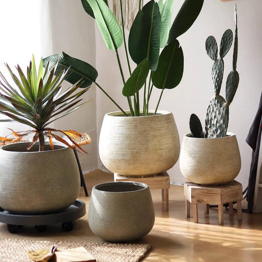 Rustic Globe Cement Planters by RusticReach; beige textured cement pots on Tampa Home & Garden Store
