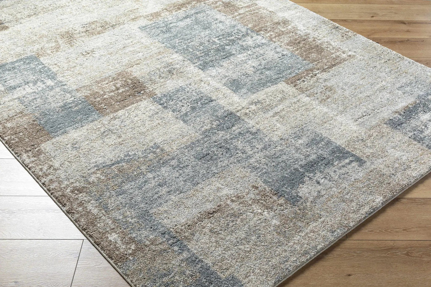Yasma Thick Luxe Rug by Boutique Rugs in blue-gray abstract pattern with plush pile on floor on Tampa Home & Garden Store