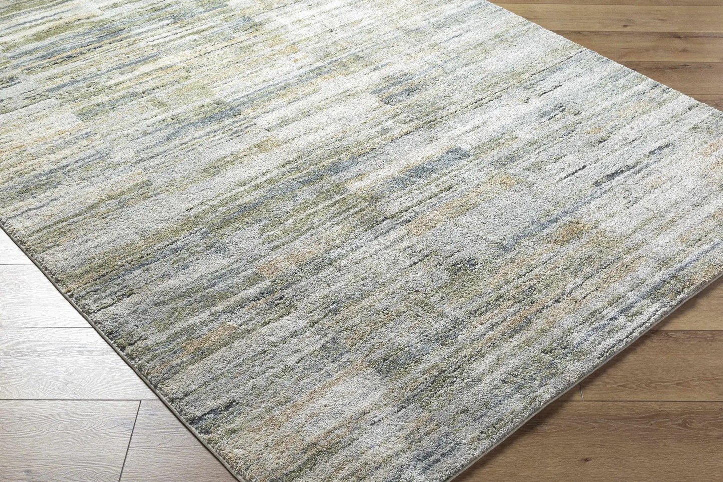 Yancy Thick Luxe Rug gray ivory multicolor tones with plush texture on wood floor on Tampa Home & Garden Store