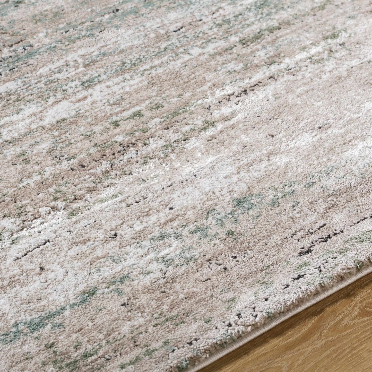 Zafer Luxe Thick Area Rug machine woven with beige cream and sage green tones, rolled edge on Tampa Home & Garden Store