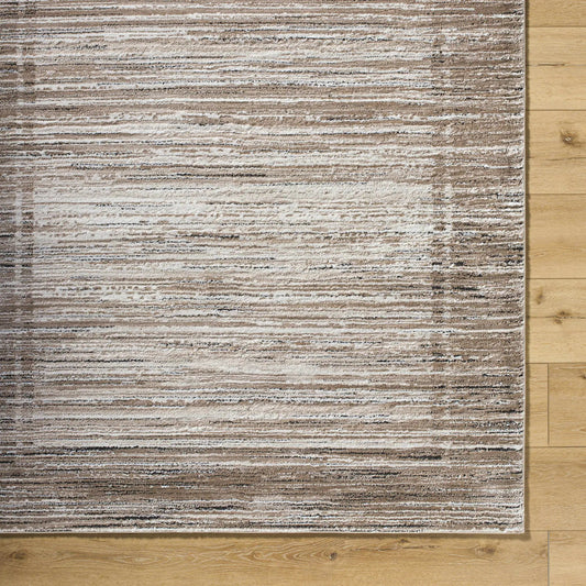 Ainhoa Luxe Thick Area Rug tan ivory beige with black accents on wood floor on Tampa Home & Garden Store