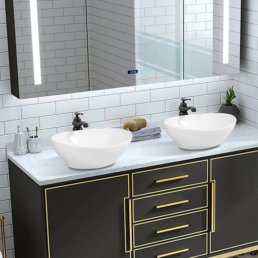 White oval ceramic vessel sinks (2) on marble countertop with black vanity on Tampa Home & Garden Store