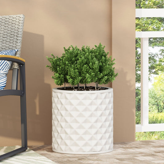 Antique White Ceramic Planter with diamond pattern and green boxwood shrubs on a patio on Tampa Home & Garden Store