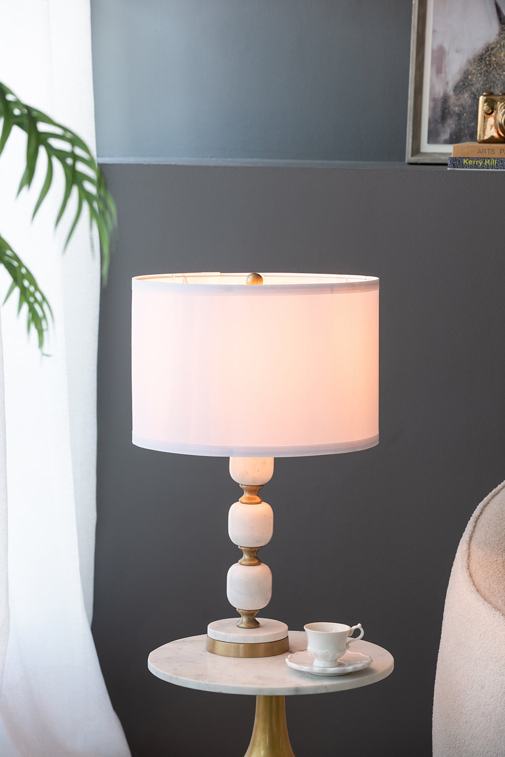 D15x26.5 Table Lamp with white drum shade, marble-like stacked base and brass accents on Tampa Home & Garden Store