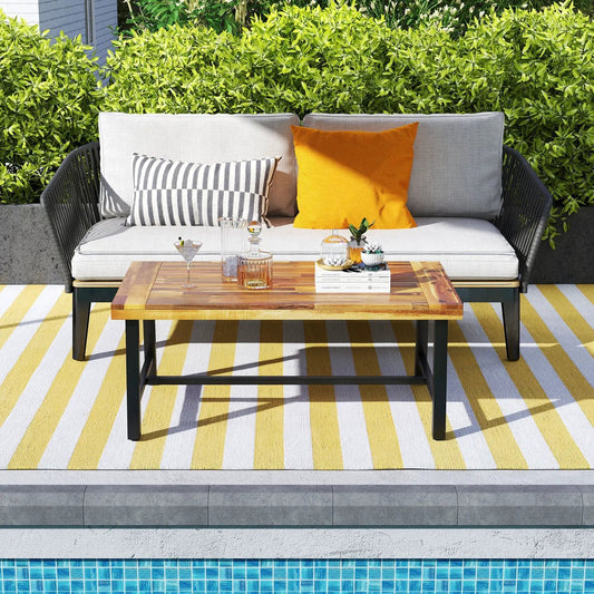 Acacia wood coffee table with thickened top and black metal legs on Tampa Home & Garden Store
