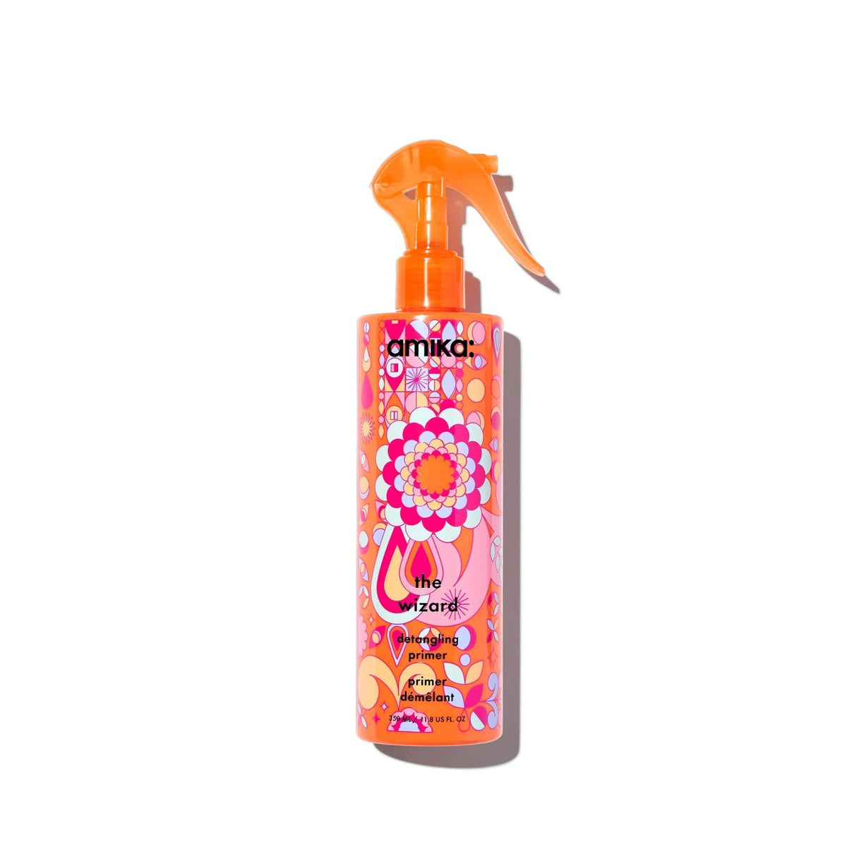 The Wizard Detangling Hair Primer bottle by Amika with orange spray top and pink packaging on Tampa Home & Garden Store