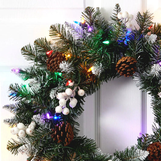 24” Snow Tipped Artificial Christmas Wreath with 50 Multicolored LED Lights, White Berries and Pine Cones - Tampa Home & Garden Store