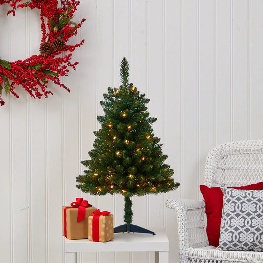 3 ft Nearly Natural Northern Spruce artificial Christmas tree with lights on white table near gift boxes on Tampa Home & Garden Store