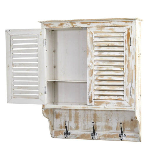 Whitewashed wall cabinet with louvered doors and metal hooks in a distressed finish on Tampa Home & Garden Store