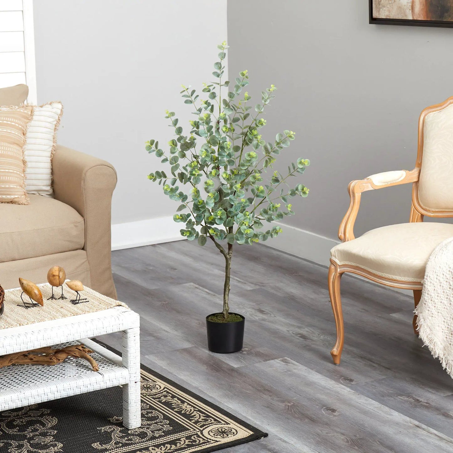 4 ft eucalyptus artificial tree with trunk in black pot in a modern living room on Tampa Home & Garden Store