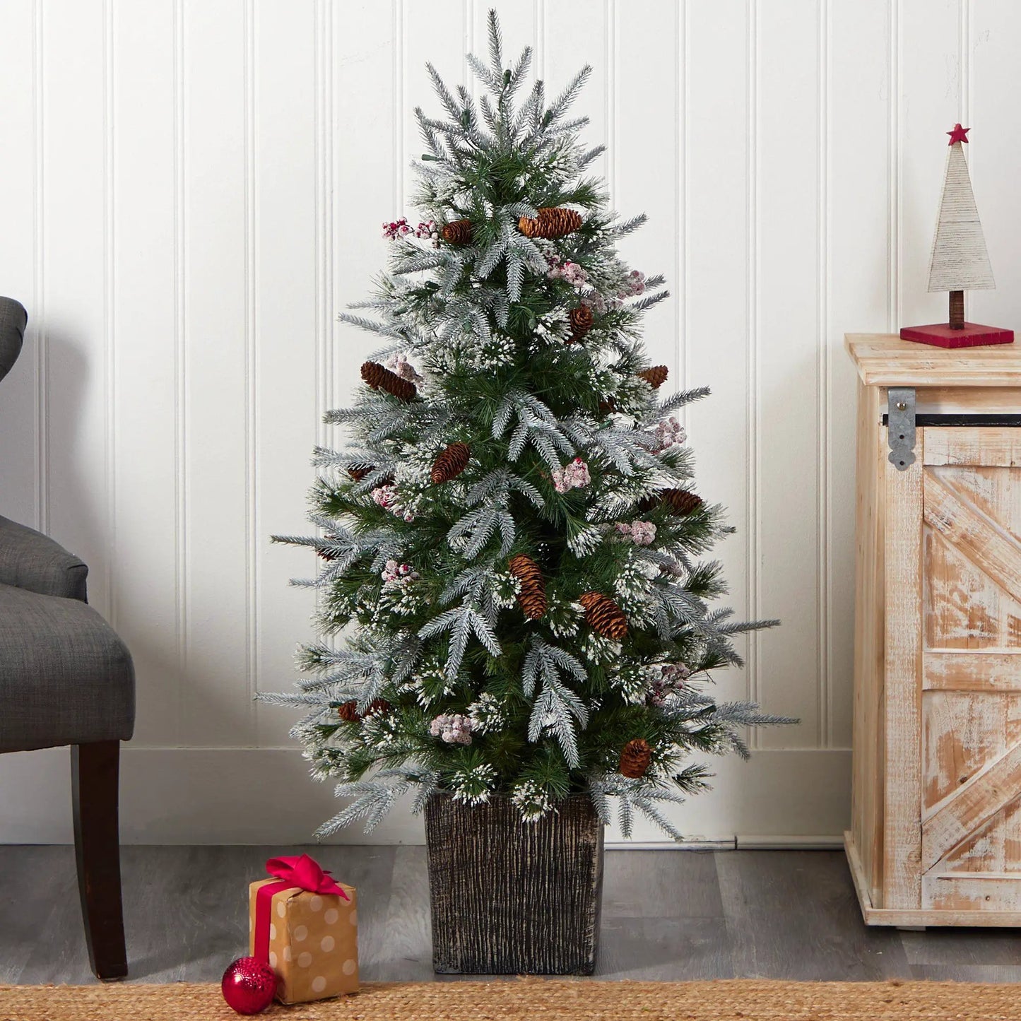 Frosted artificial Christmas tree with 105 lights in a planter, needles and pinecones on Tampa Home & Garden Store