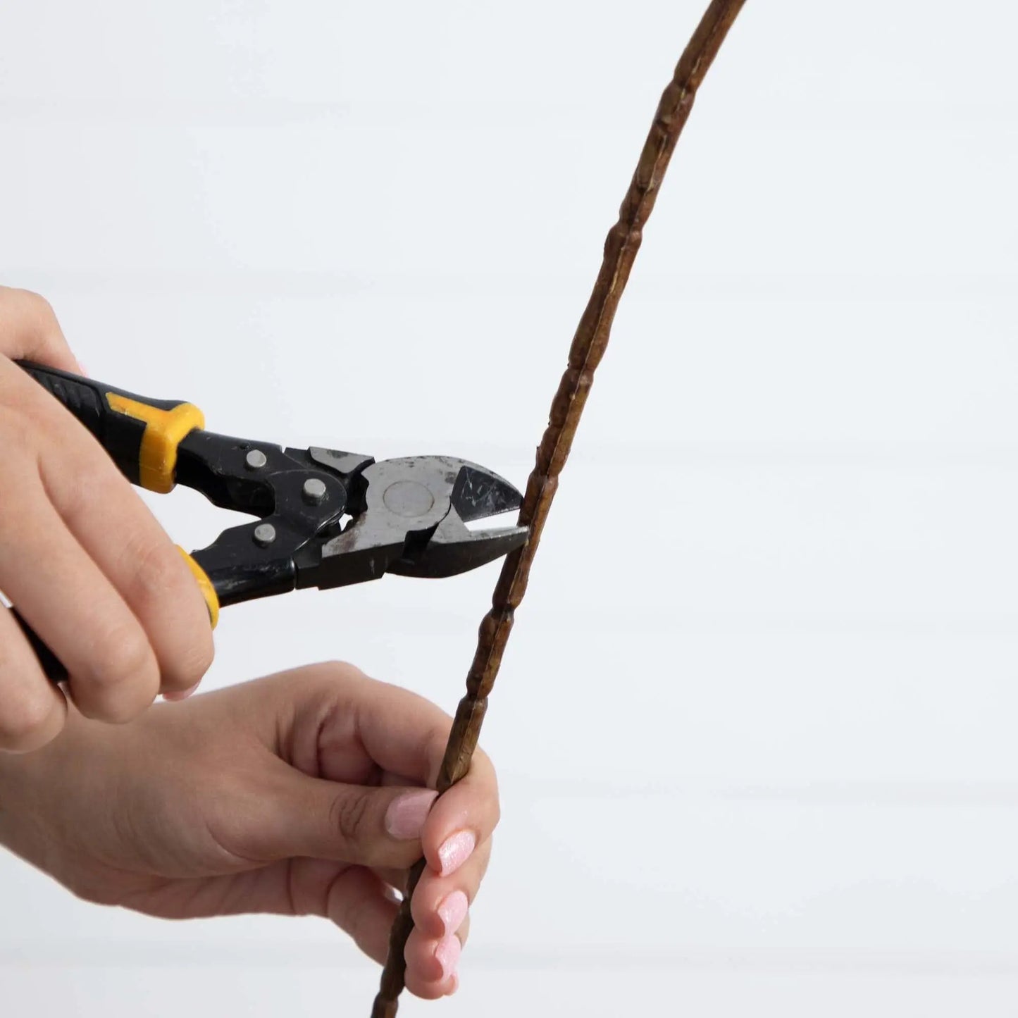 Cherry Blossom stems set of 3 brown artificial stems being trimmed by hand on Tampa Home & Garden Store