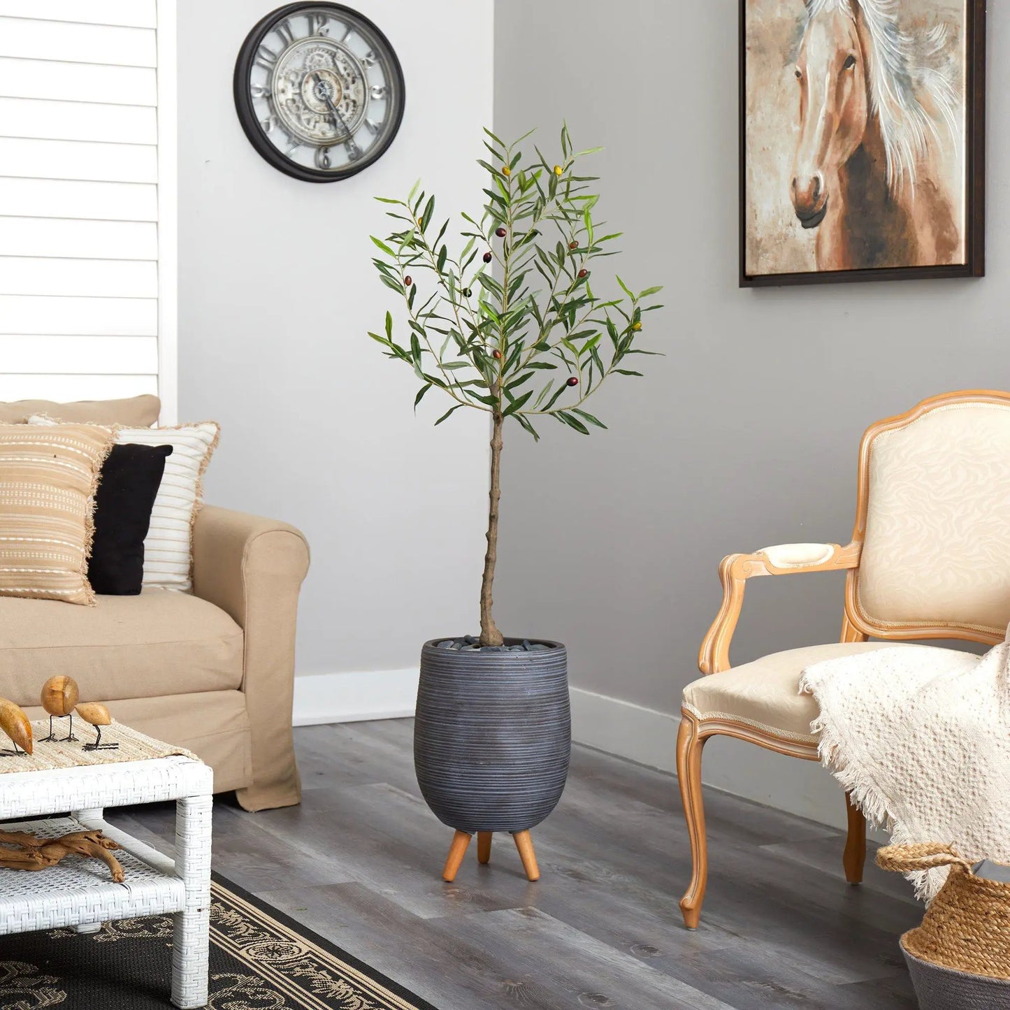 Artificial olive tree in gray planter on a wooden stand on Tampa Home & Garden Store
