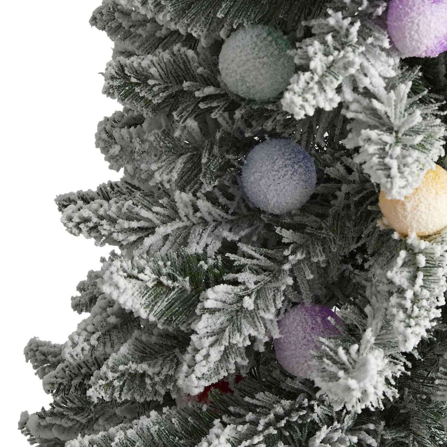 Flocked Mountain Fir artificial Christmas Tree close-up with pastel blue and lavender ornaments on Tampa Home & Garden Store