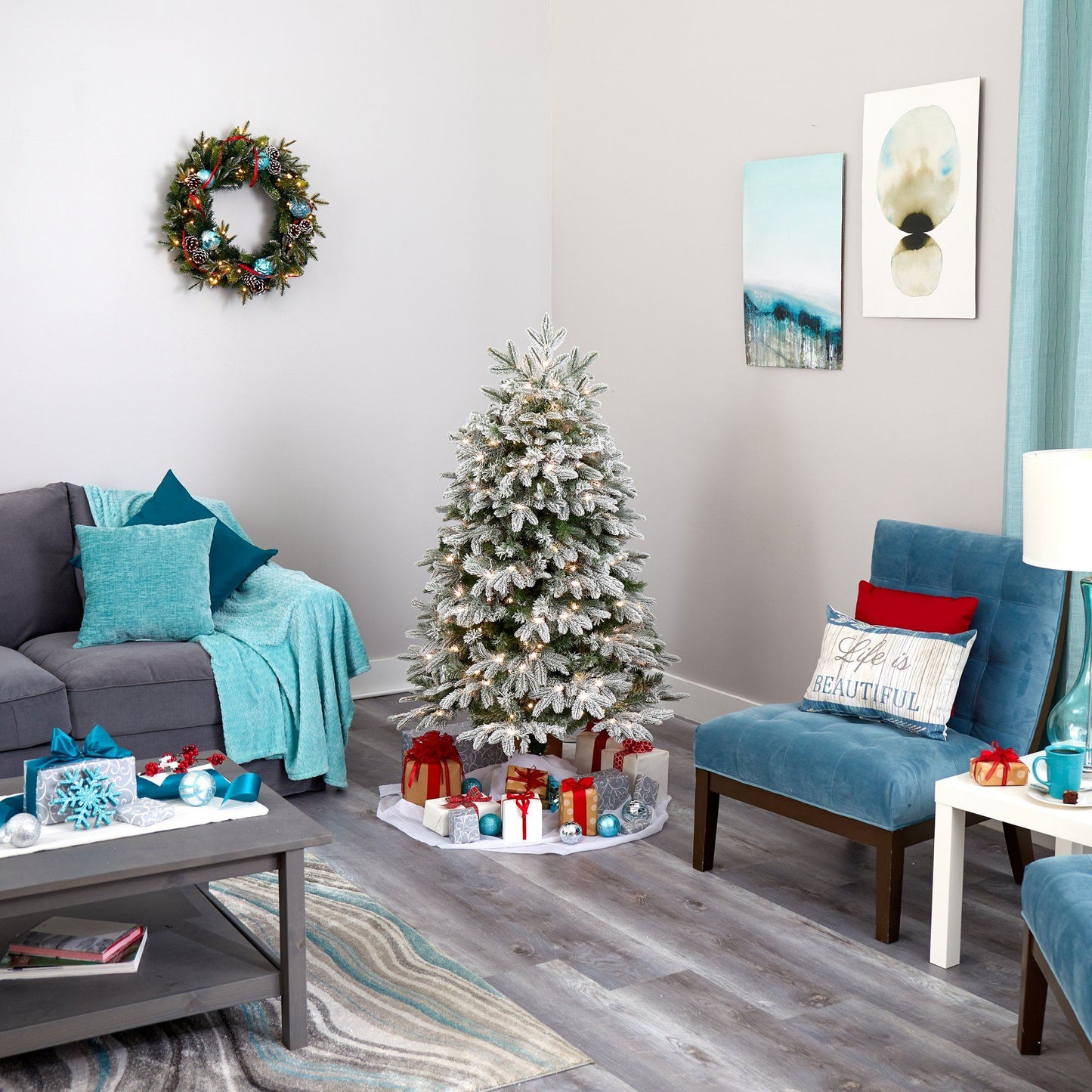 Five Foot Flocked Fir Artificial Christmas Tree with snow-tipped branches in a living room on Tampa Home & Garden Store