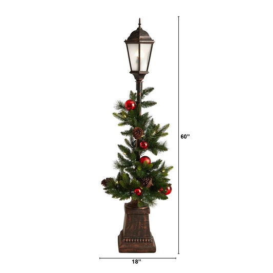 5 ft holiday lamp post with rustic brown lantern, wrapped in greenery and red ornaments with pinecones on Tampa Home & Garden Store