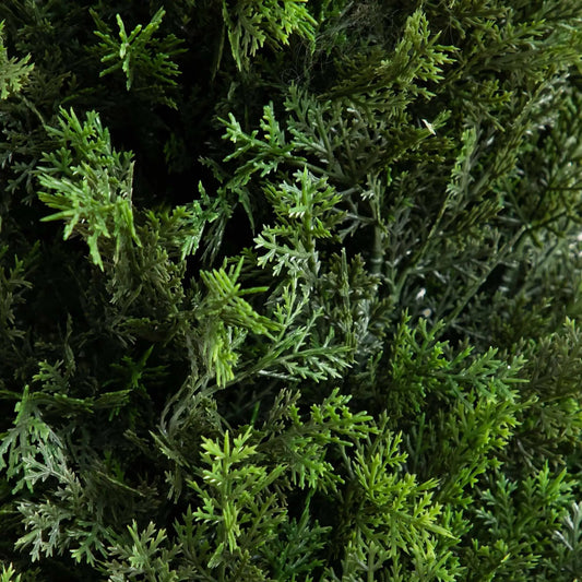 Artificial cedar tree foliage close-up with dense green needles on Tampa Home & Garden Store
