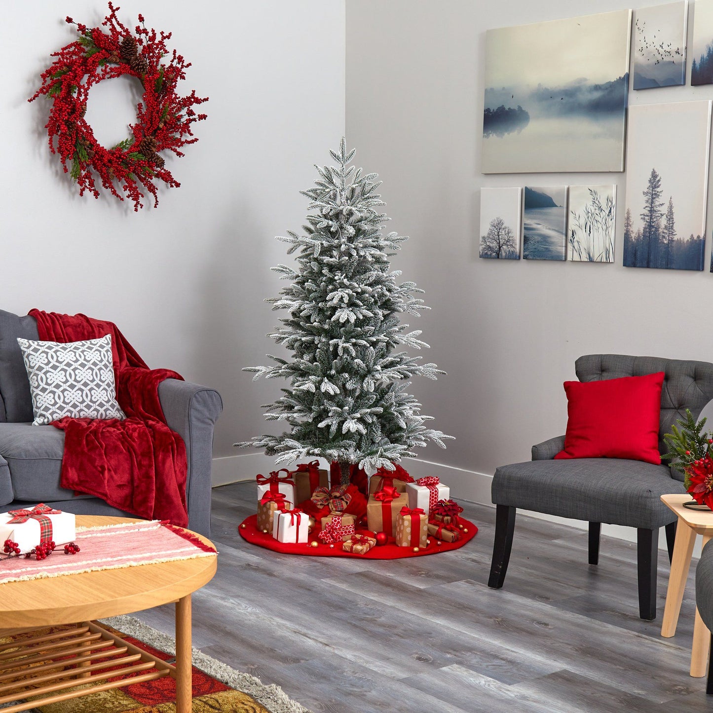 5.5’ flocked Manchester Spruce Christmas tree with frosted branches beside 1 wreath on Tampa Home & Garden Store