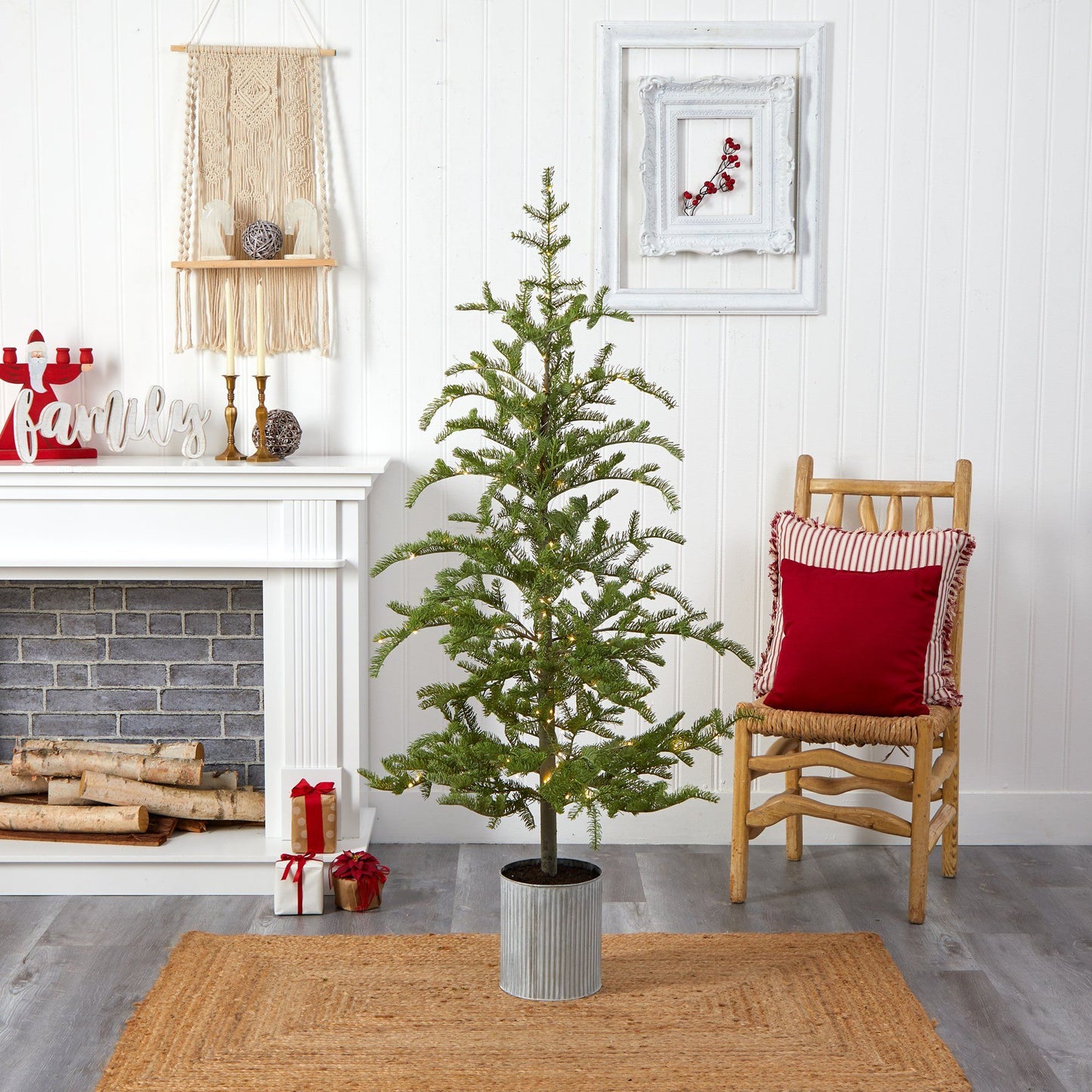 5.5 ft Pre-Lit Pine Tree in a metal planter with warm lights on Tampa Home & Garden Store
