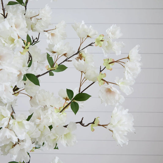 6 ft artificial cherry blossom tree with white blooms and green leaves against a white backdrop on Tampa Home & Garden Store