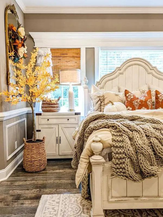Nearly Natural Autumn Maple 6ft artificial tree in woven basket beside bed in a cozy bedroom on Tampa Home & Garden Store
