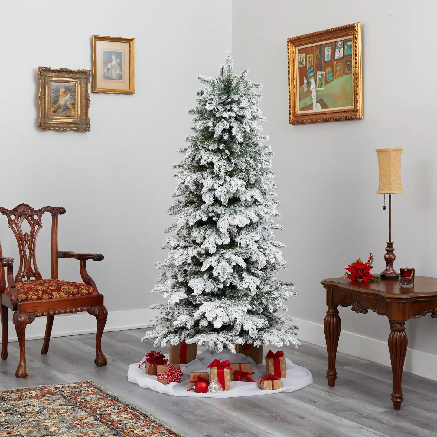 Flocked North Carolina Fir Christmas Tree with lights in a snowy living room scene on Tampa Home & Garden Store