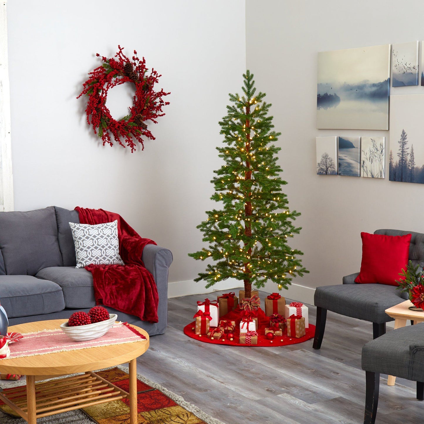 Fairbanks Fir artificial Christmas tree with warm LED lights in a cozy living room on Tampa Home & Garden Store